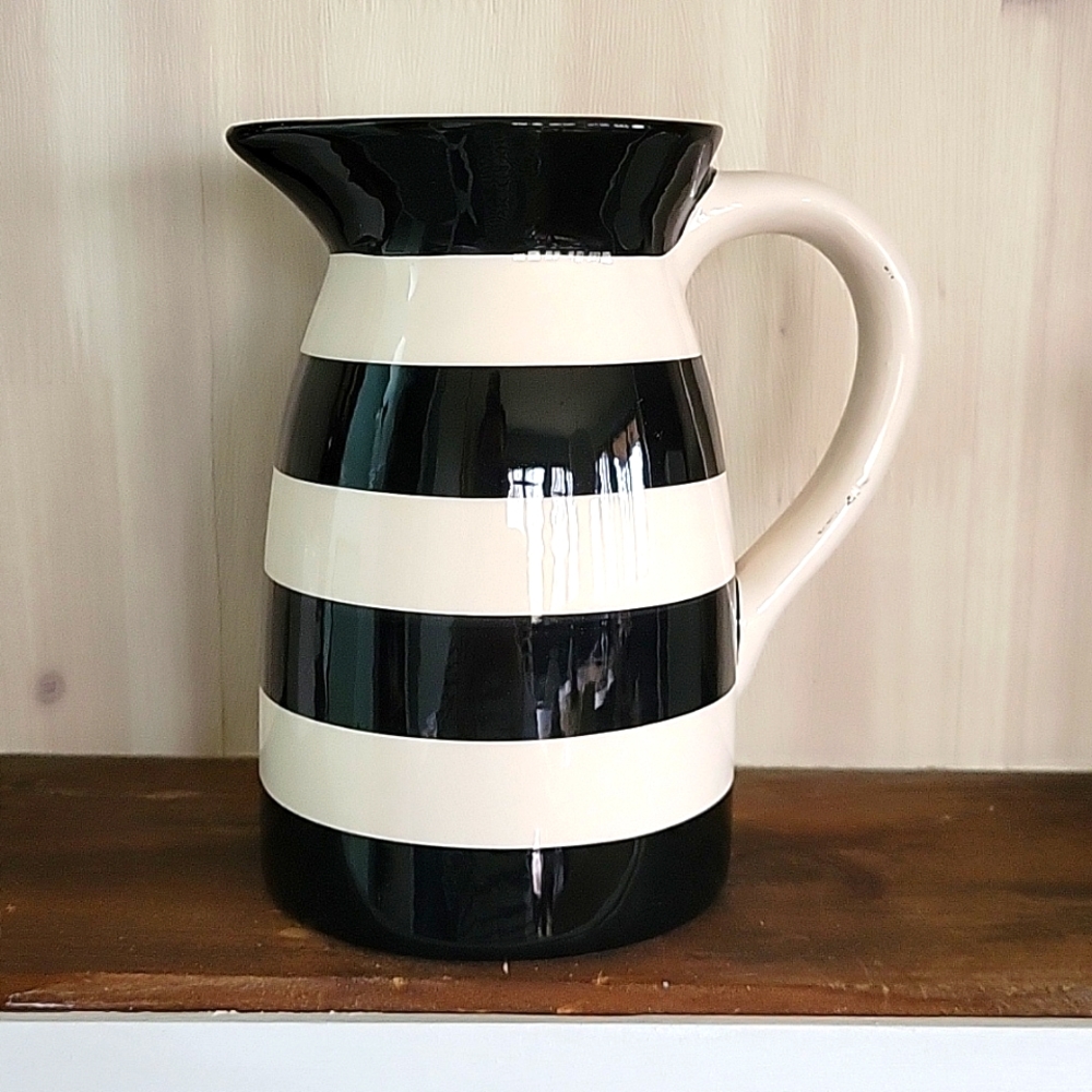 Black and white ceramic pitcher bid vase